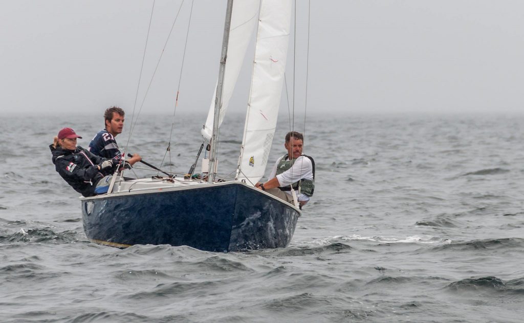 Jim Taylor, Nat Taylor & Cindy Smith sail upwind at the 2015 Rhodes 19 National Championship